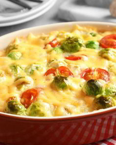 Картофель и брюссельская капуста с сыром и помидорами