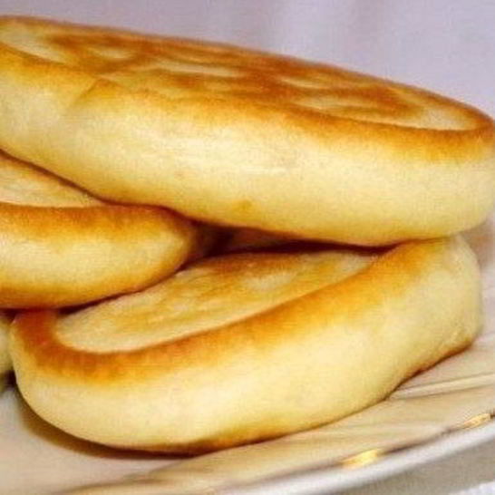 Рецепт пышных оладий без яиц на кефире